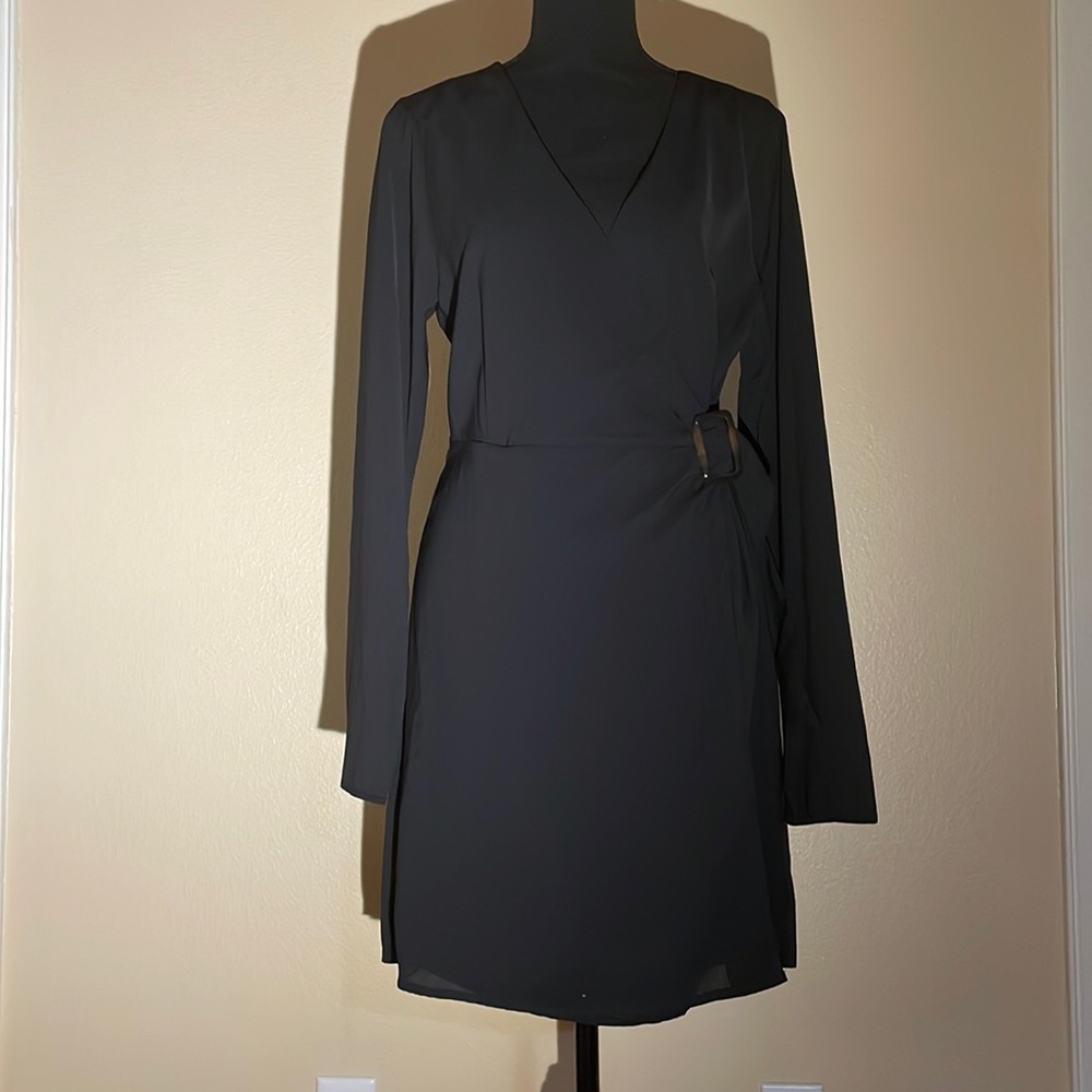 Black v neck dress with buckle detail.  Wrap front dress